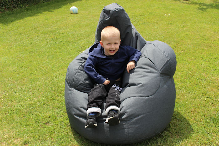 Sitting on bean bag armchair