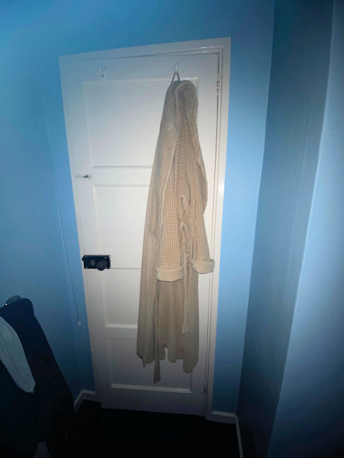 Bathrobe hanging on bathroom door