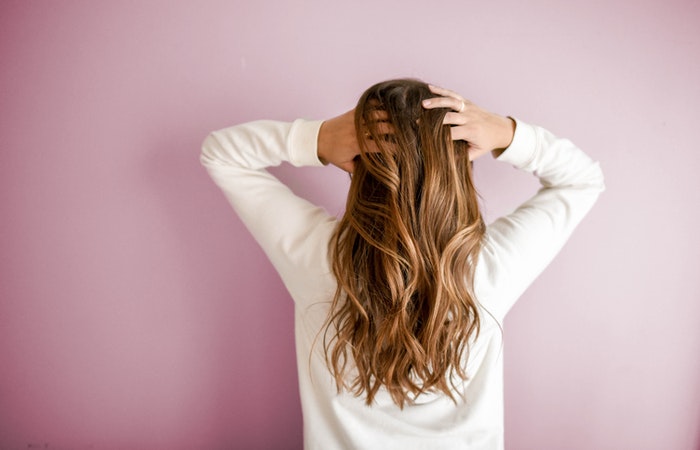 Keeping Your Hair Thick as You Age - Woman long hair back view