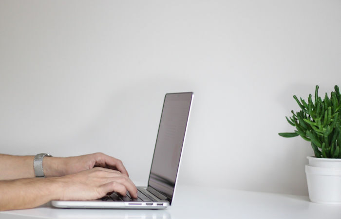 work from home laptop typing