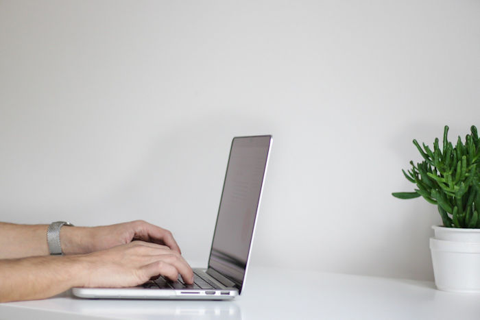 working from home laptop typing